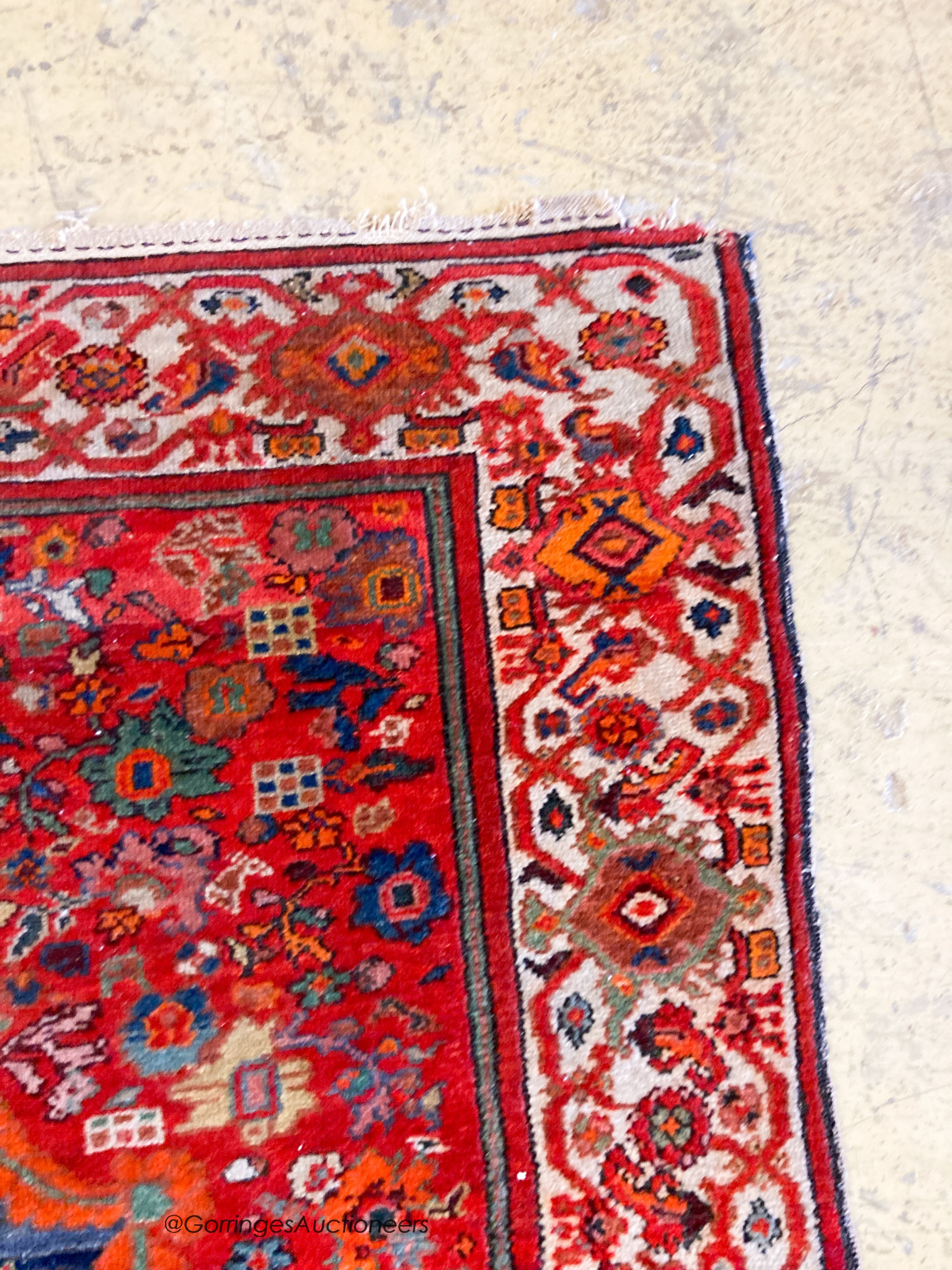 A North West Persain red ground rug, 200 x 132cm